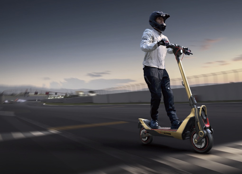 Rendering of a helmeted person riding the UT5 Ultra X e-scooter on a racetrack.