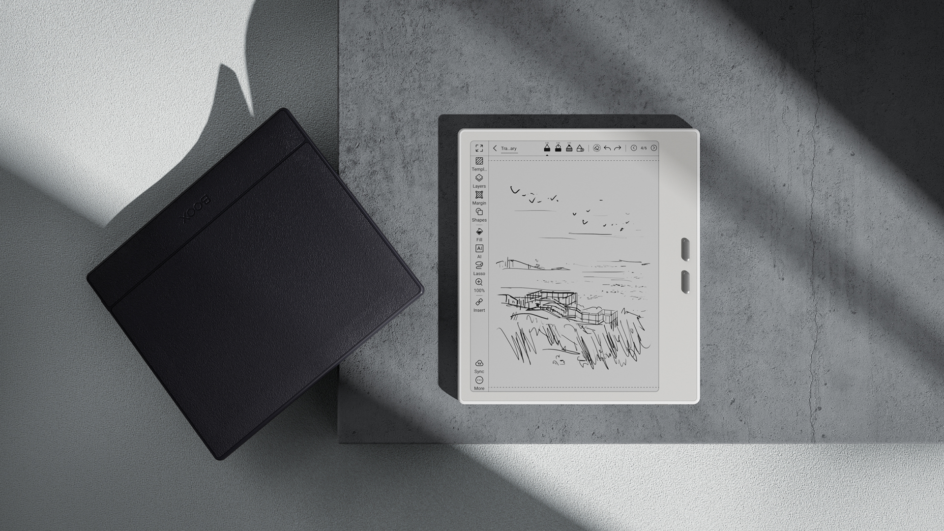 The Boox Go 7 E Ink tablet sitting on a table with dramatic lighting.