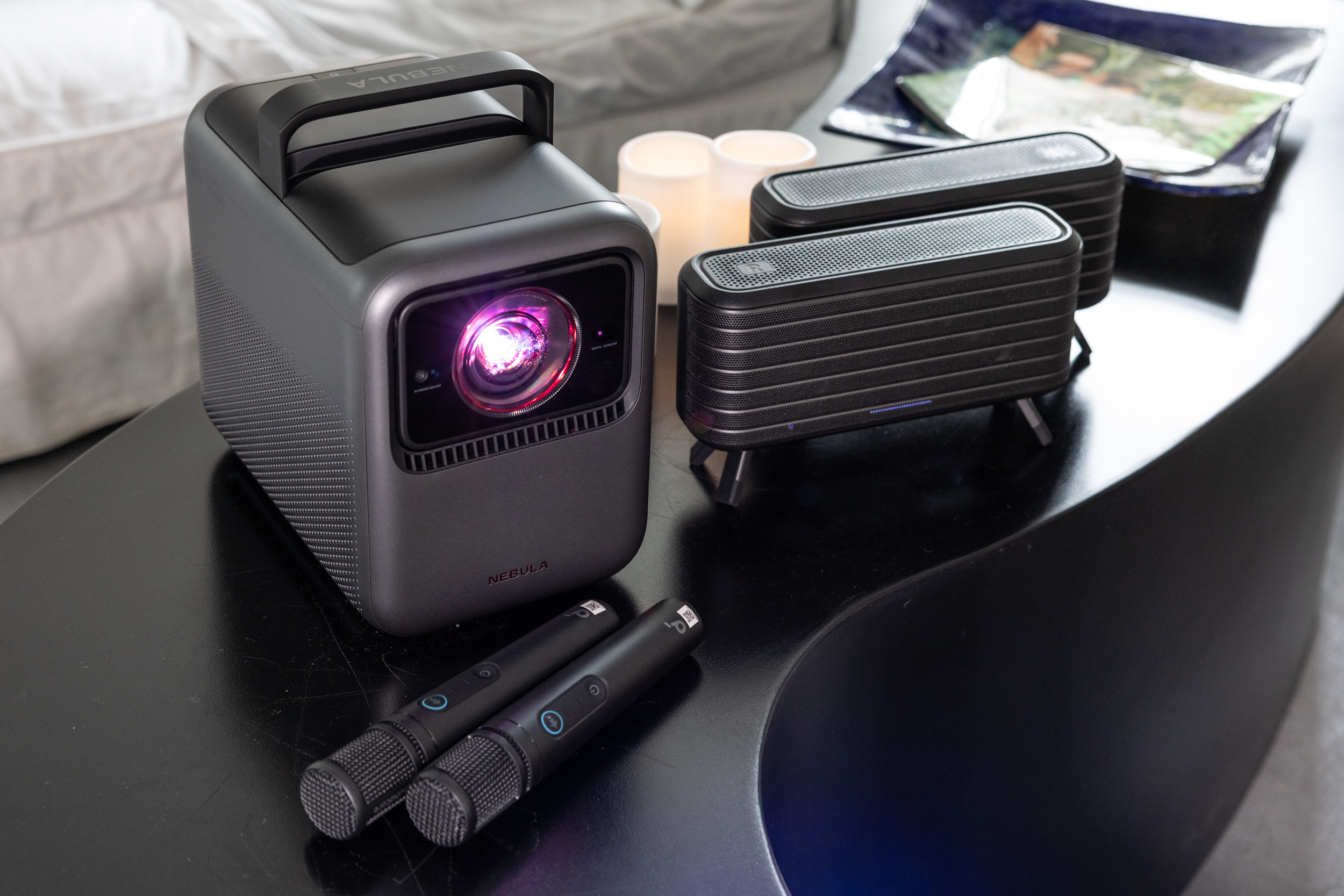 You can purchase the Nebula X1 in a package with Nebula-branded satellite speakers and karaoke microphones.