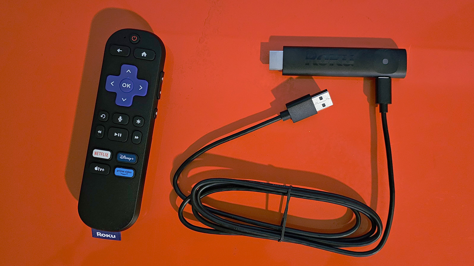 The Roku Streaming Stick Plus with the remote and dongle and USB cable