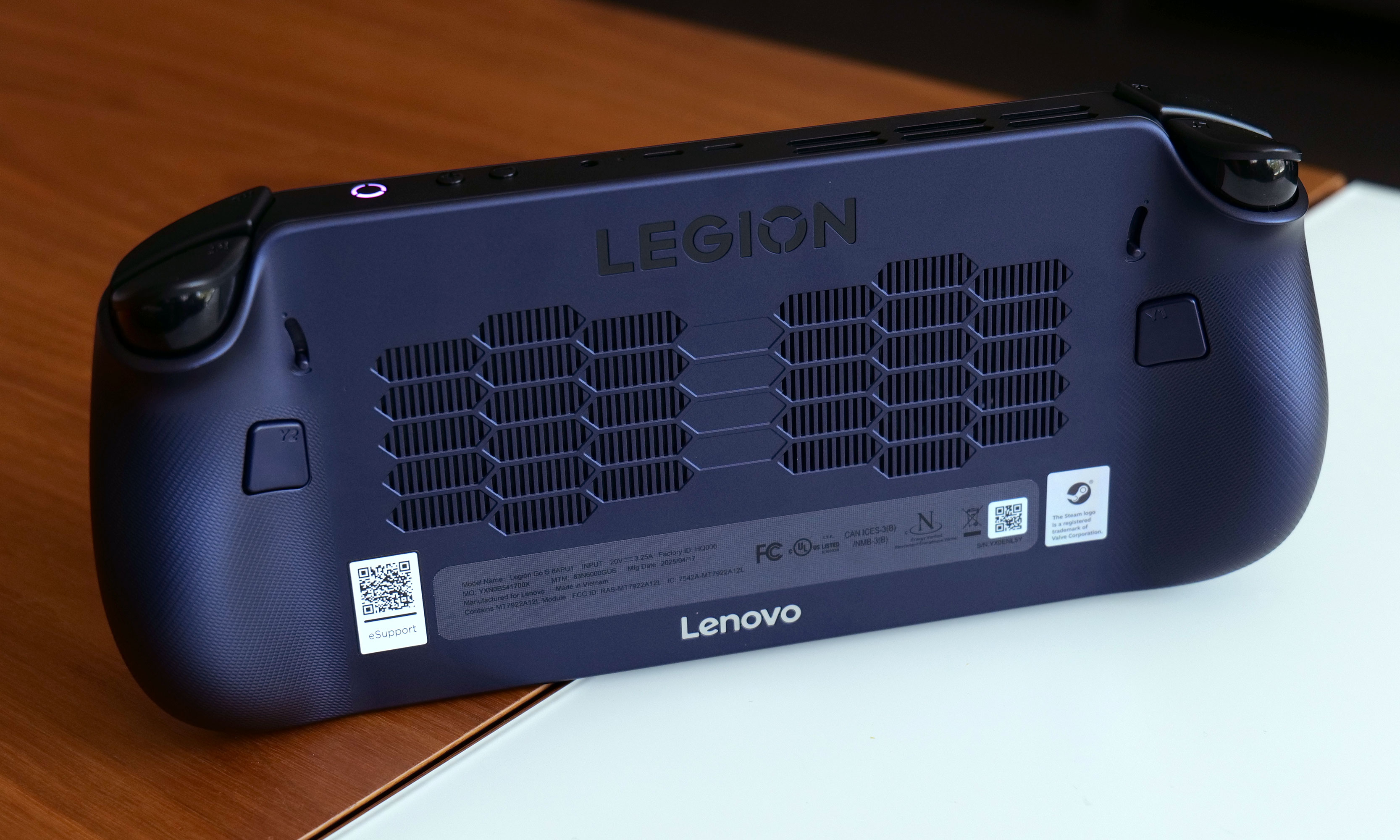 The Legion Go S features a pair of customizable paddles in back. 