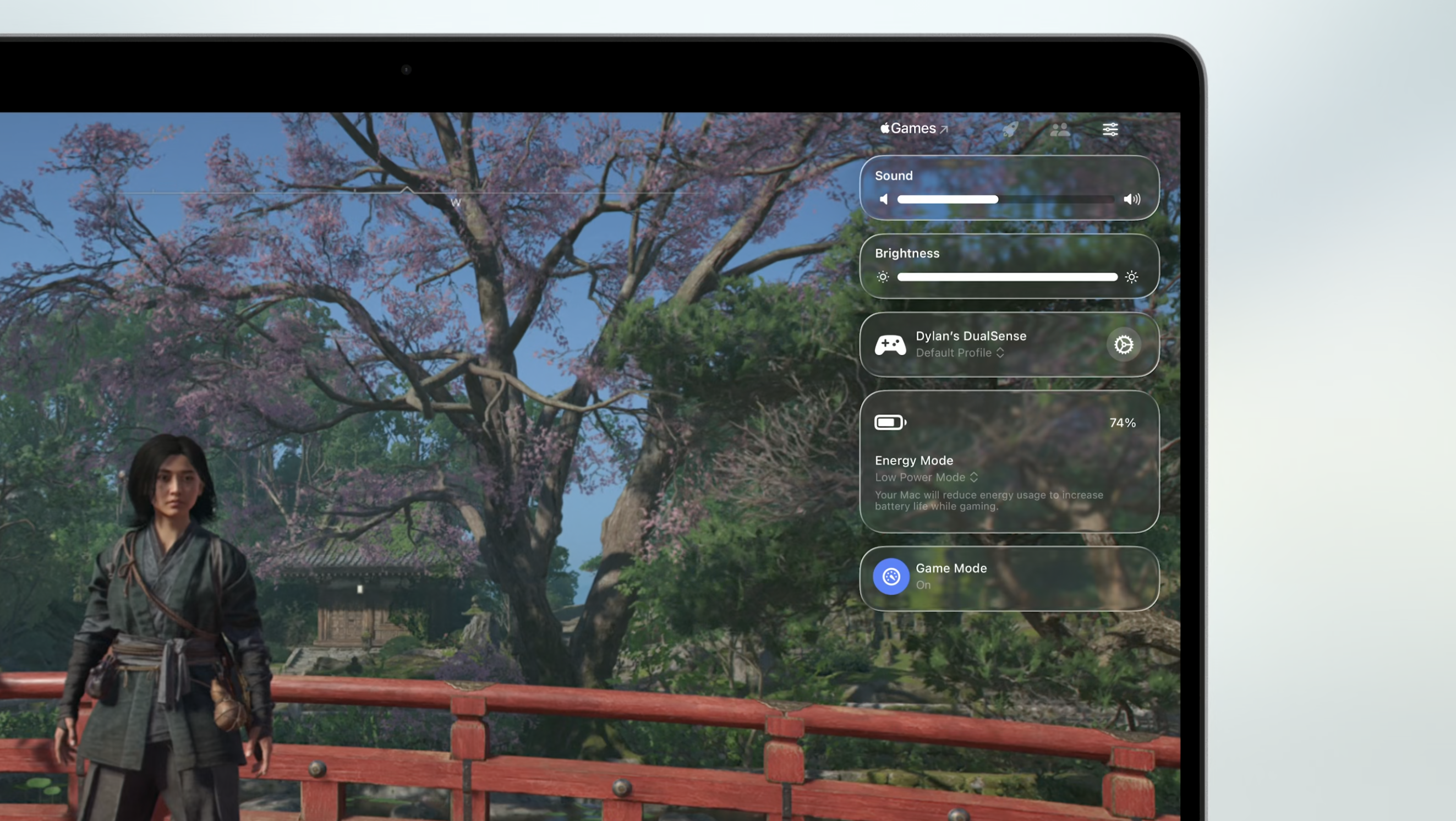 Apple Games app overlay on a Mac laptop.