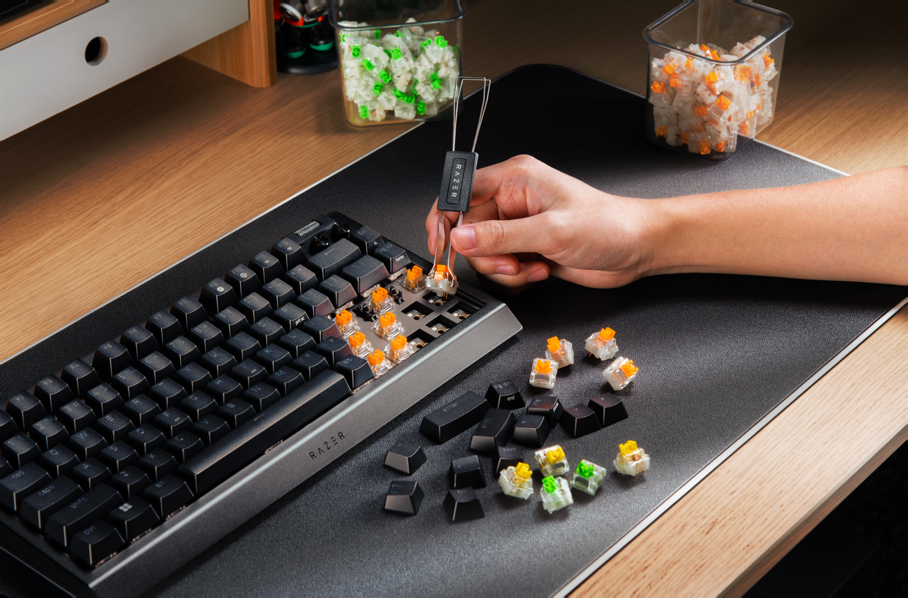 Photo of a person assembling the BlackWidow V4 75% Barebones keyboard.