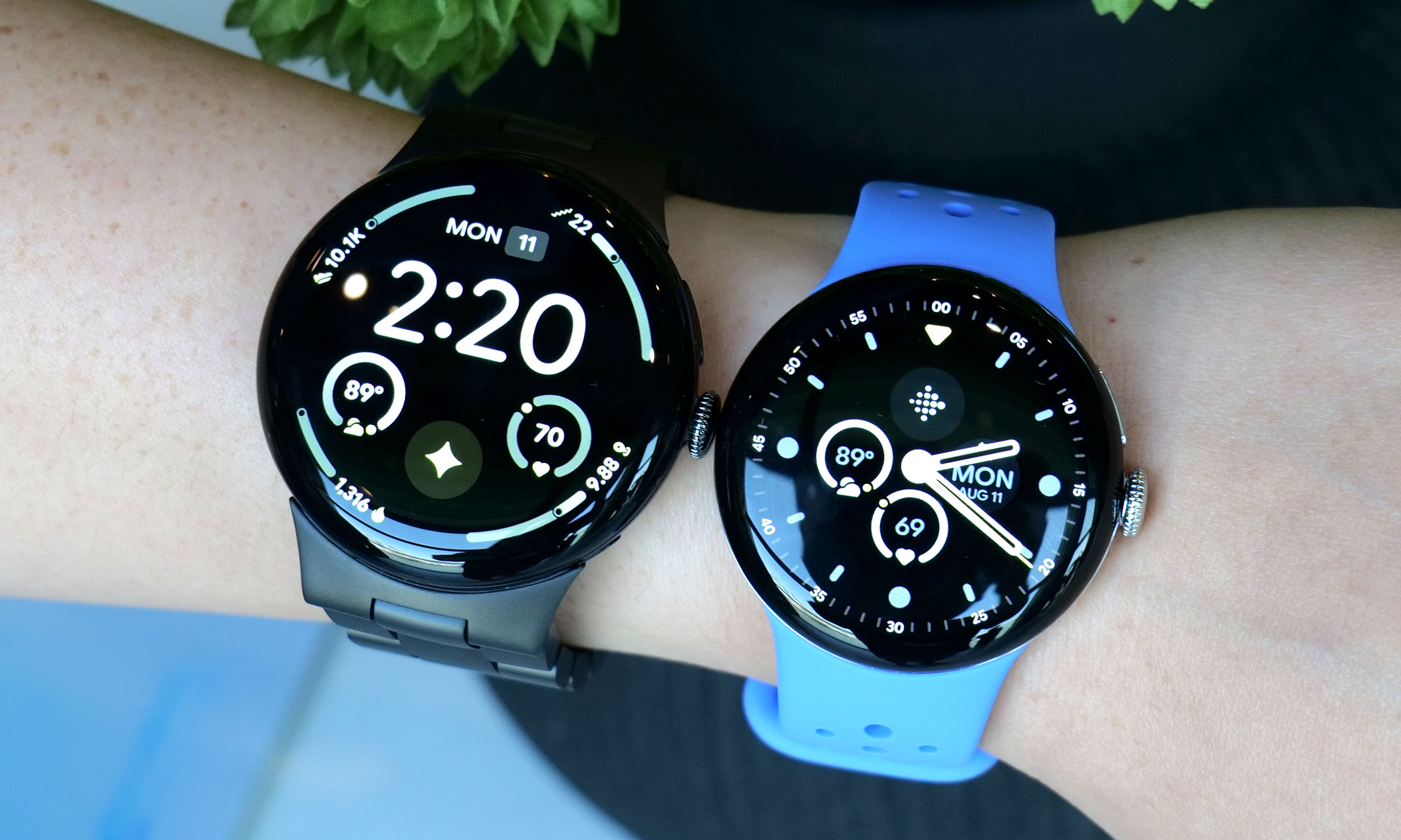A large Pixel Watch 4 and smaller Pixel Watch 4 side by side on the same wrist.