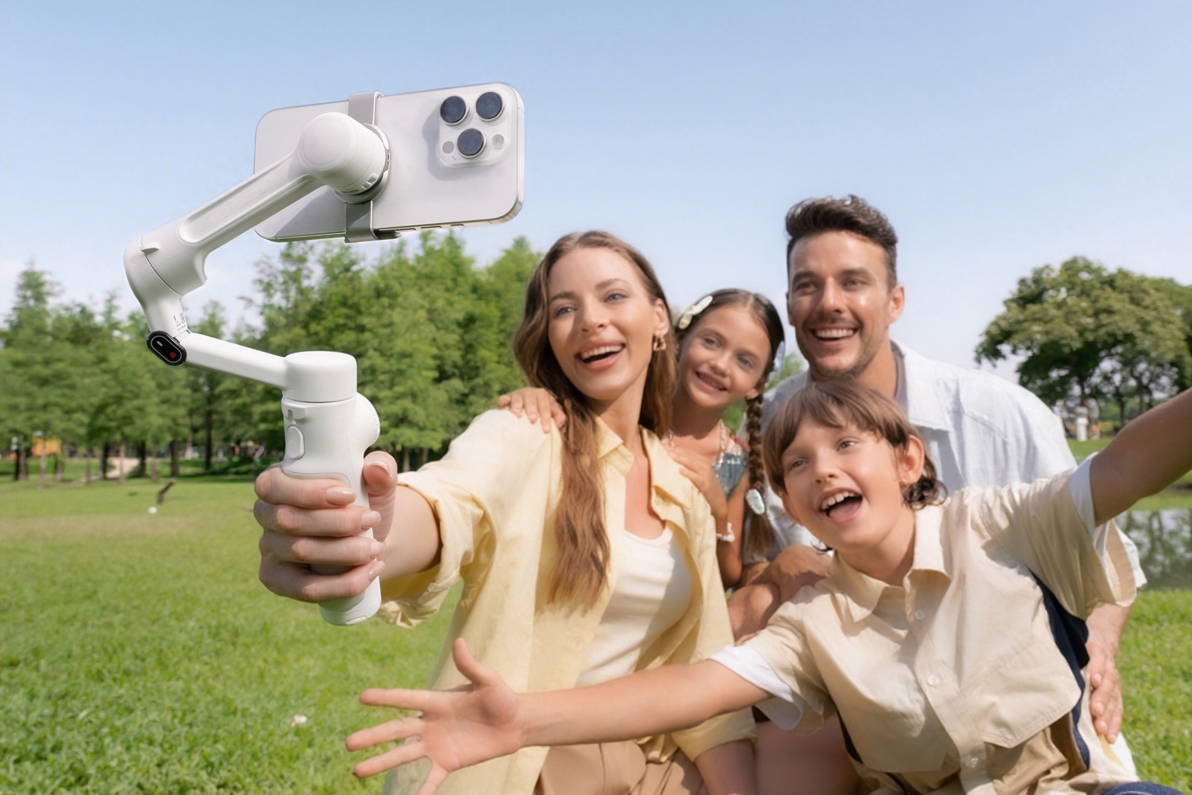 A family taking a selfie with the Insta360 Flow 2 camera gimble.