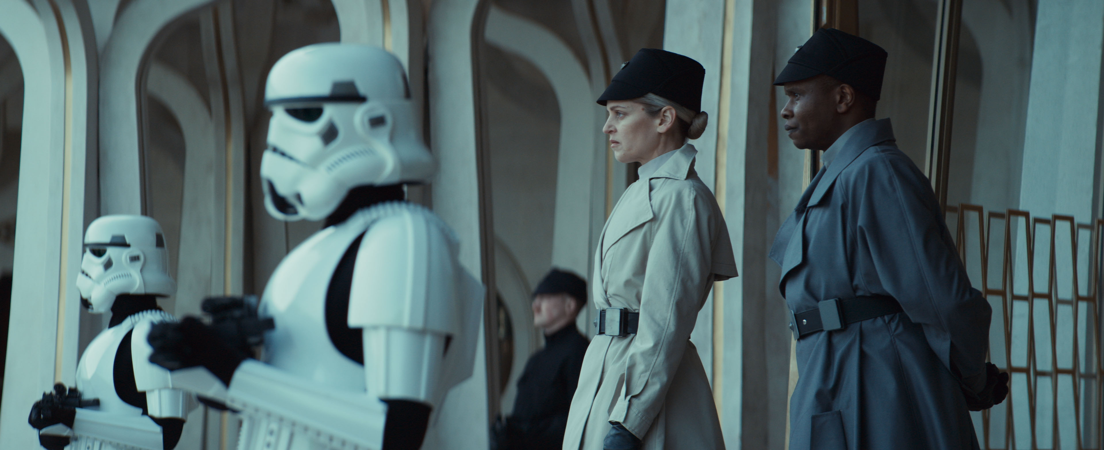 (Second from Left - R) Dedra Meero (Denise Gough) and Grymish (Kurt Egyiawan) in Lucasfilm's ANDOR Season 2, exclusively on Disney+. Â©2025 Lucasfilm Ltd. & TM. All Rights Reserved.