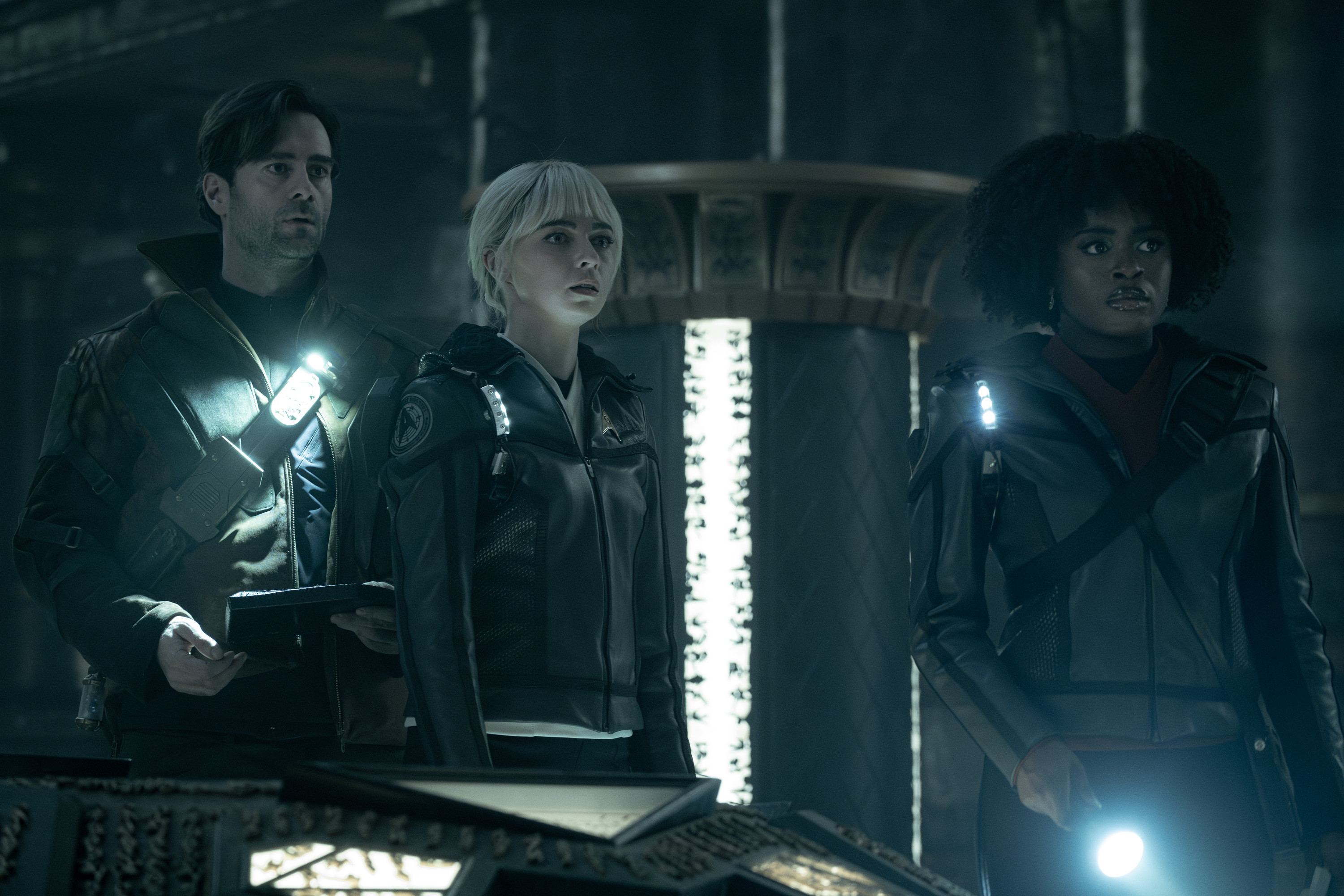 L to R Cillian O\'Sullivan as Dr. Roger Korby, Jess Bush as Chapel and Celia Rose Gooding as Uhura in season 3 , Episode 5 of Strange New Worlds streaming on Paramount+. Photo Credit: Marni GrossmanParamount+ 