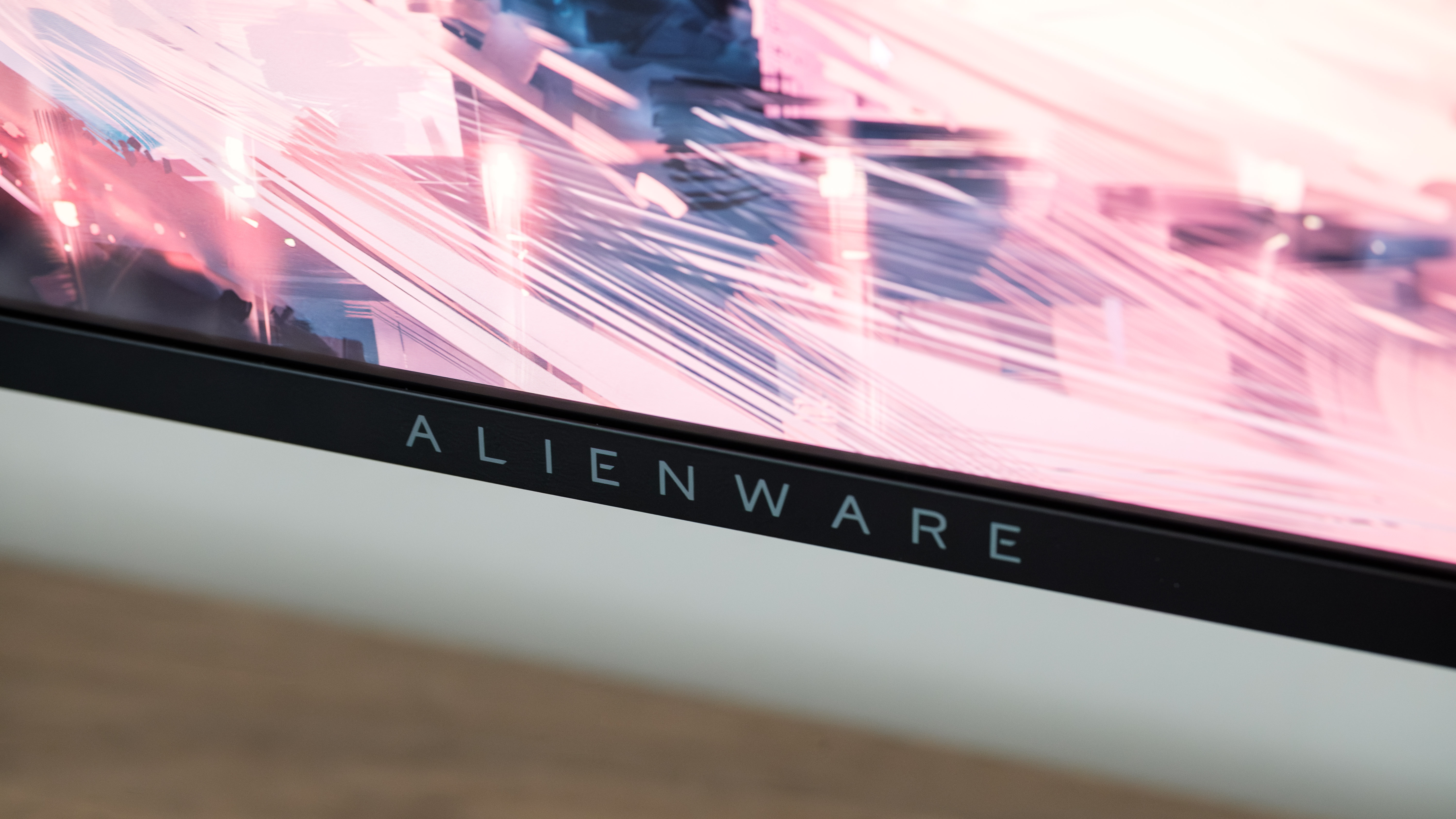 A closeup of the Alienware AW2725Q's badge. 