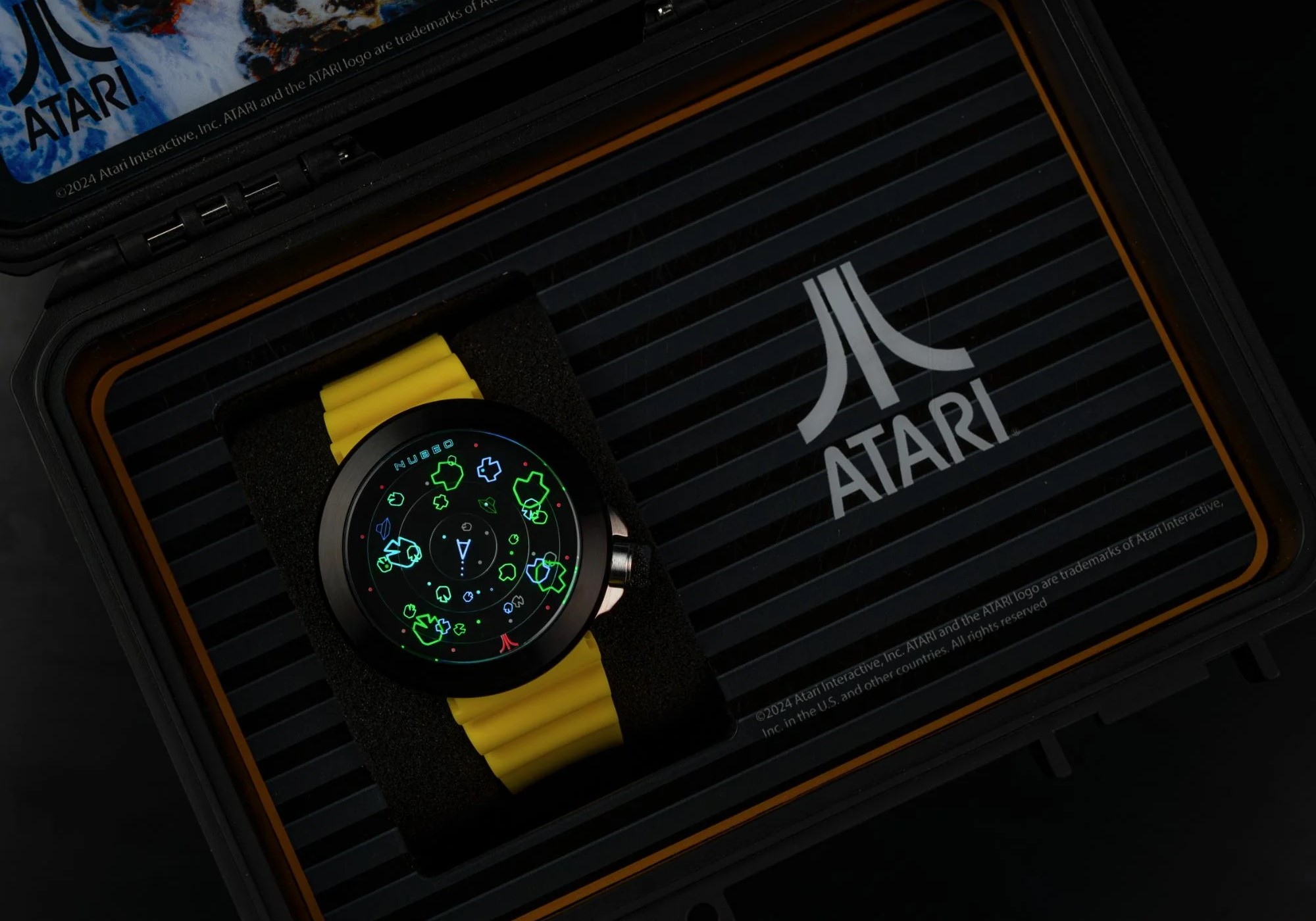 Asteroids-themed watch with a yellow band in an Atari-branded case.