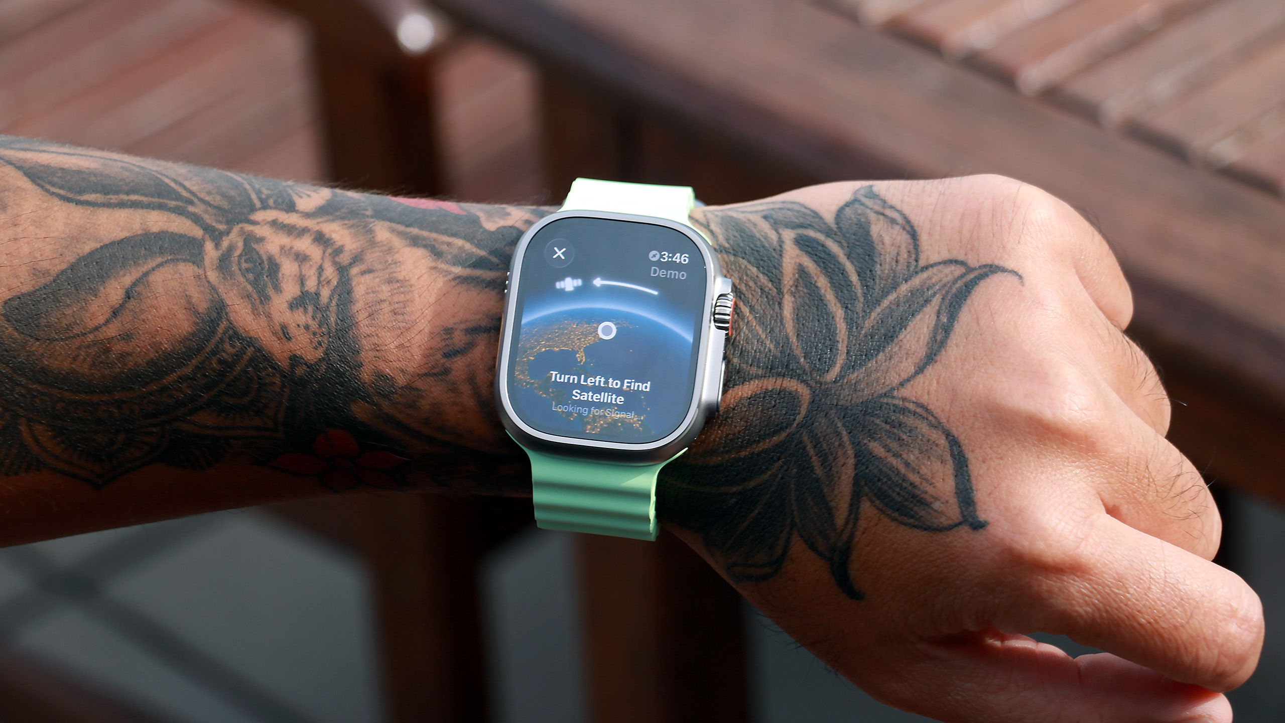 The Apple Watch Ultra 3 showing its satellite connection page on its screen, with guidance telling the user to 