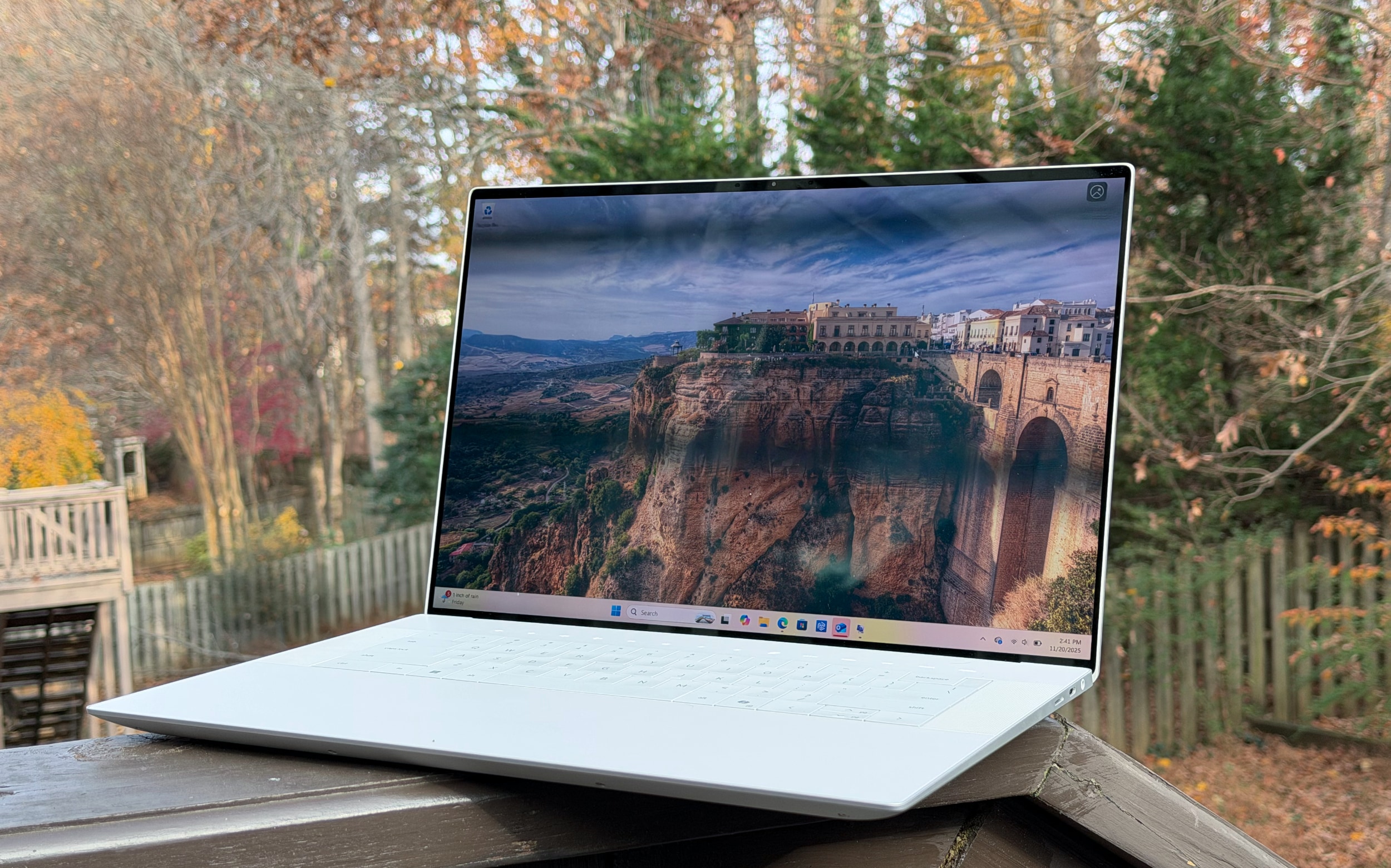 The Dell 16 Premium sitting on a ledge.