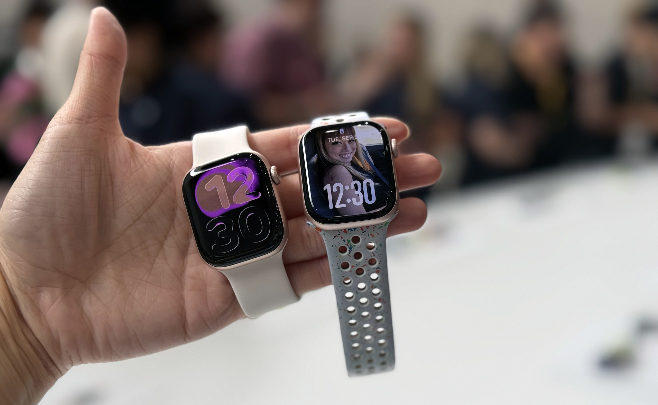 Apple Watch Series 11 (left) next to the Series 10 (right).