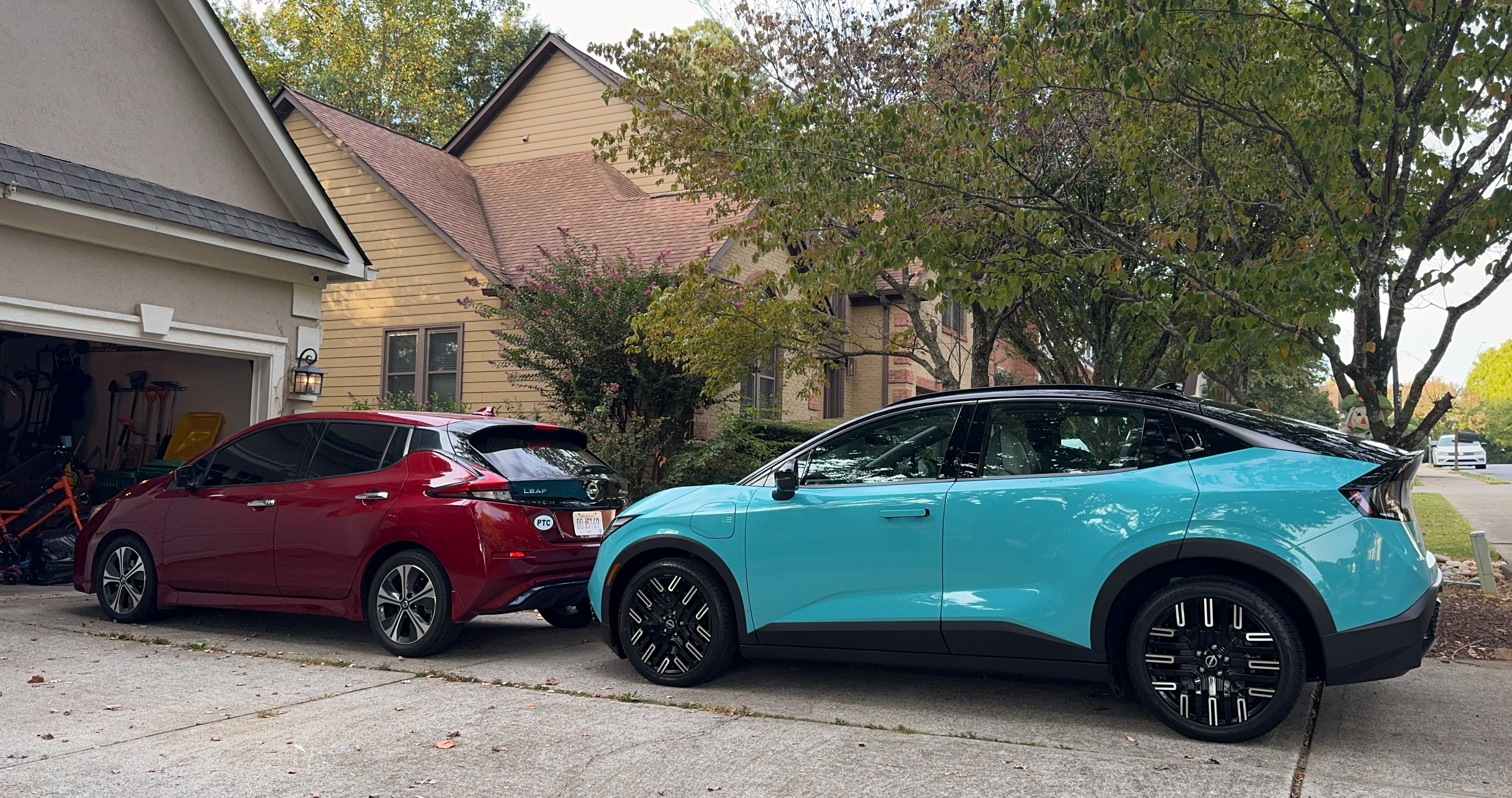 The nissan Leaf 2018 (left) next to the 2026 model (right).