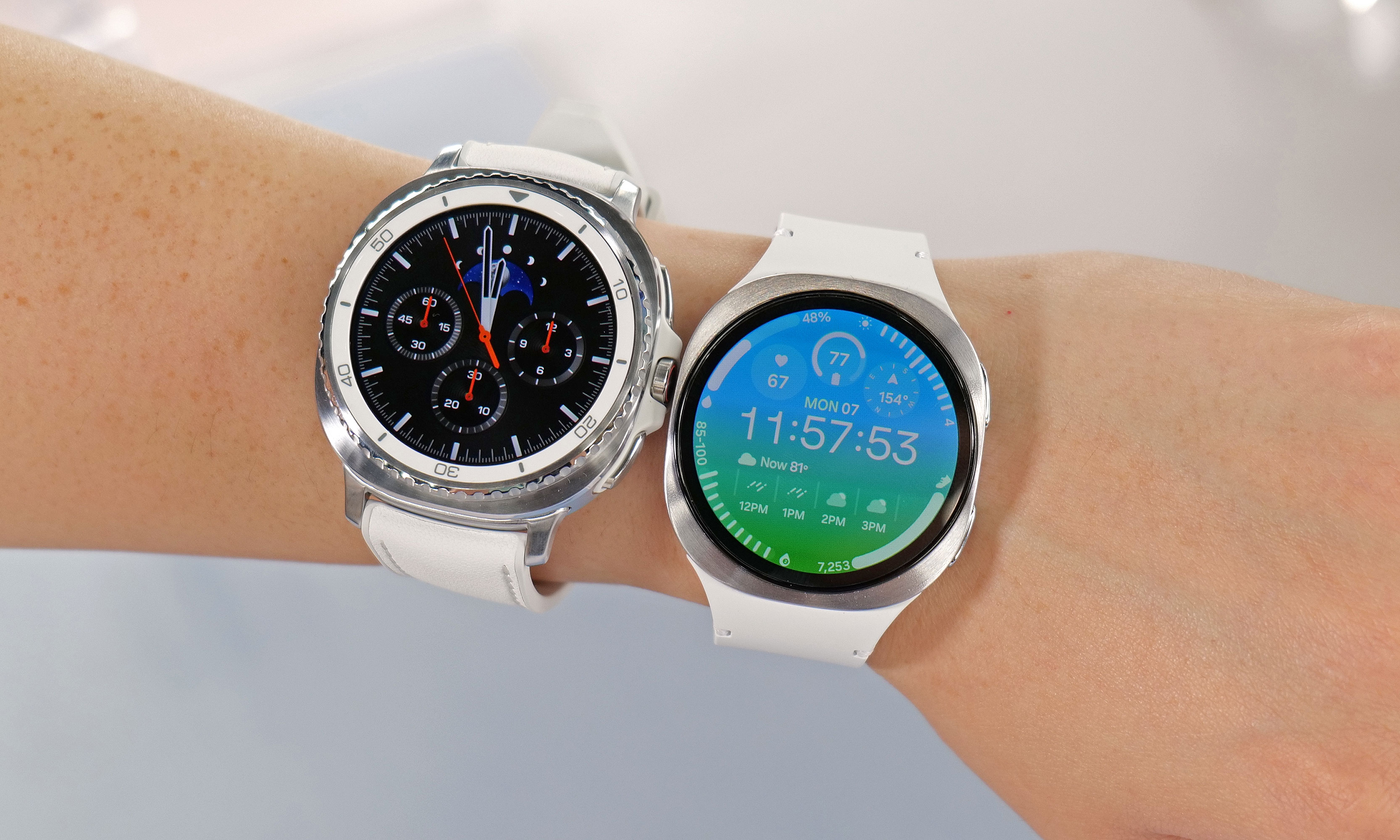 The Galaxy Watch 8 Classic and Watch 8 next to one another on a person's wrist. 