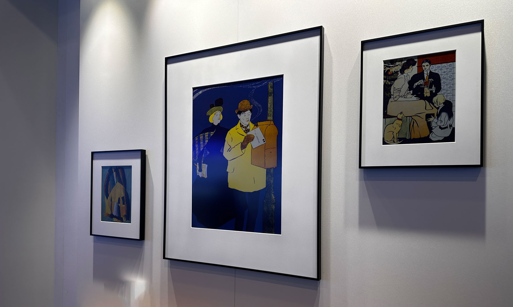 Image of three InkPoster models, two smaller ones flanking the middle-sized one, on a wall.