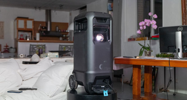Image of the Soundcore Nebula X1 on a dais in the center of a beautiful French living room