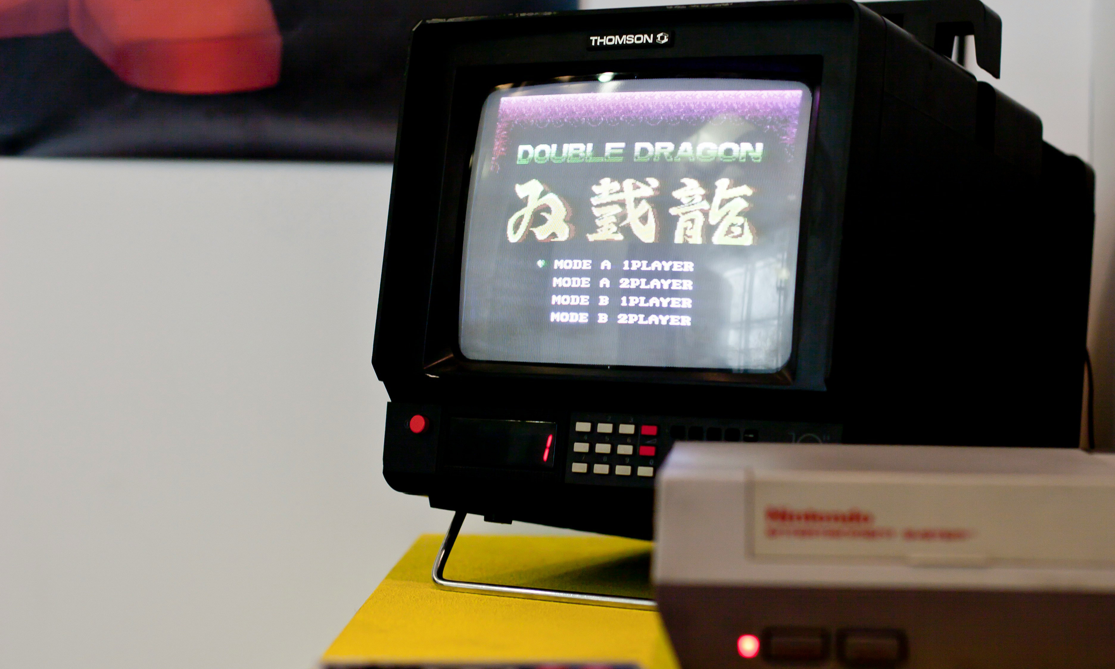 Photo of an old television playing the NES version of Double Dragon. NES console visible in the foreground.