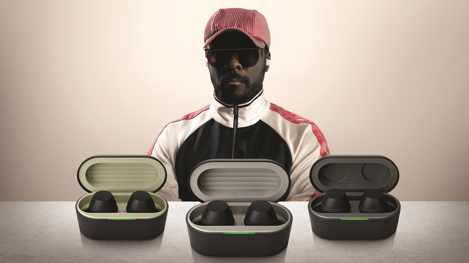 Will.i.am standing with devices.