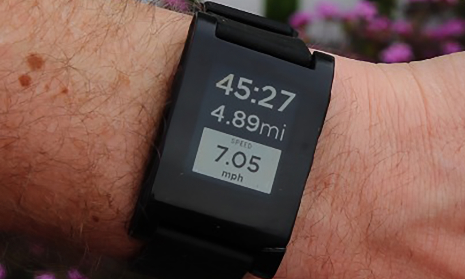 Closeup of the original Pebble smartwatch on a person’s wrist.