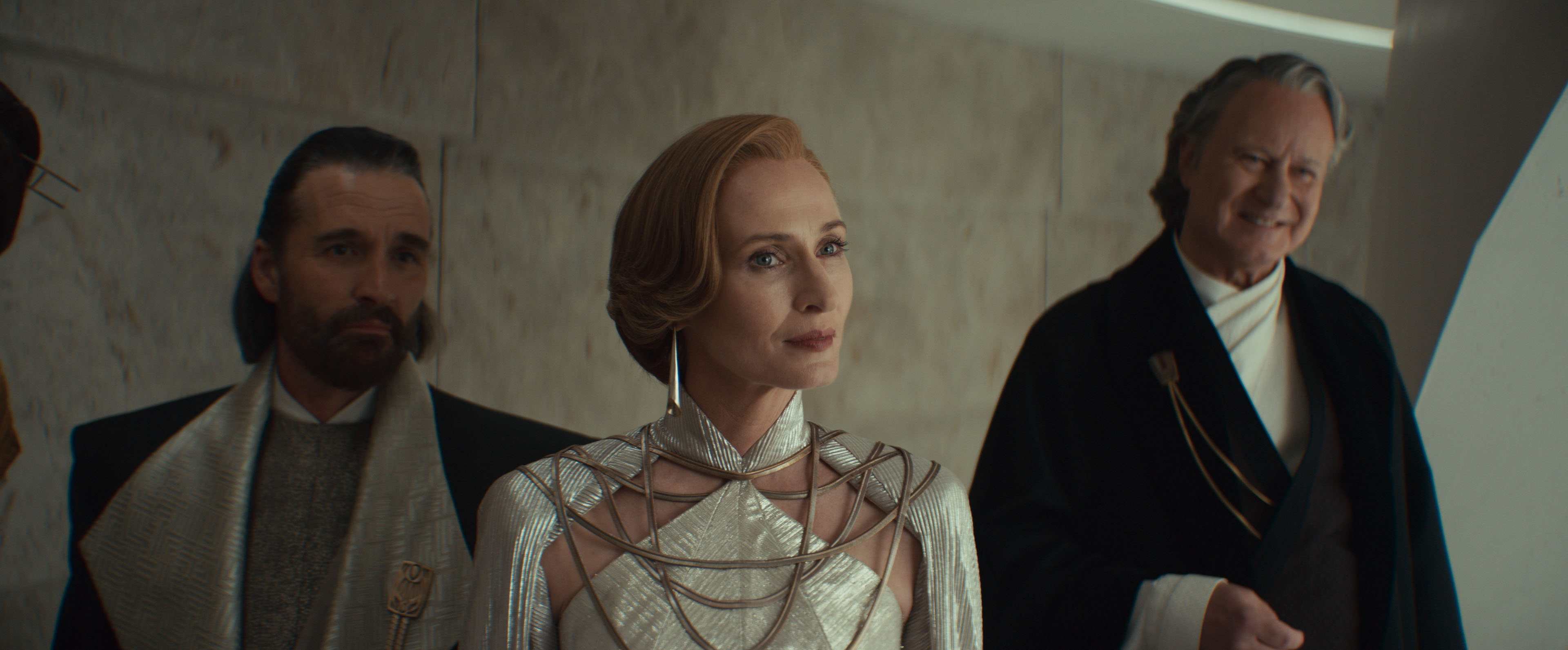 (L-R) Perrin Fertha (Allistair Mackenzie), Mon Mothma (Genevieve O'Reilly) and Luthen Rael (Stellan SkarsgÃ¥rd) in Lucasfilm's ANDOR Season 2, exclusively on Disney+. Photo courtesy of Lucasfilm. Â©2025 Lucasfilm Ltd. & TM. All Rights Reserved.