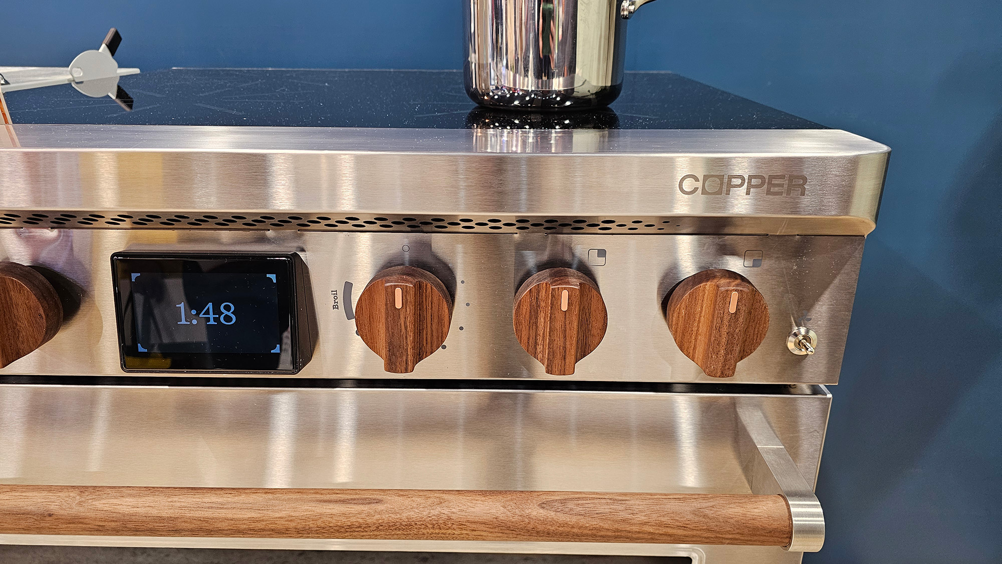 The Copper Charlie stove close up shot that shows the wooden knobs. 