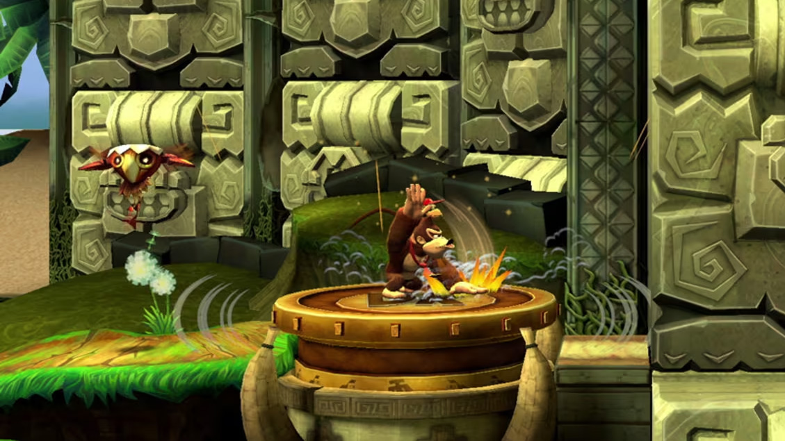 Donkey Kong Country Returns gameplay still. DK slapping a platform.