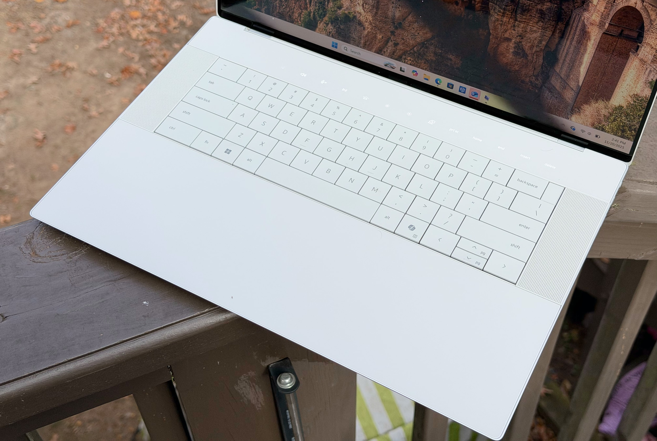 The 16 Premium's invisible trackpad blends seamlessly into its wrist rest, while the keyboard lays perfectly flat and a row of capacitive function keys sits above.
