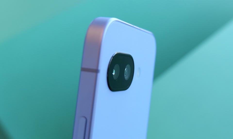 Angled view of the back of the Pixel 9a phone, showing its camera lens.