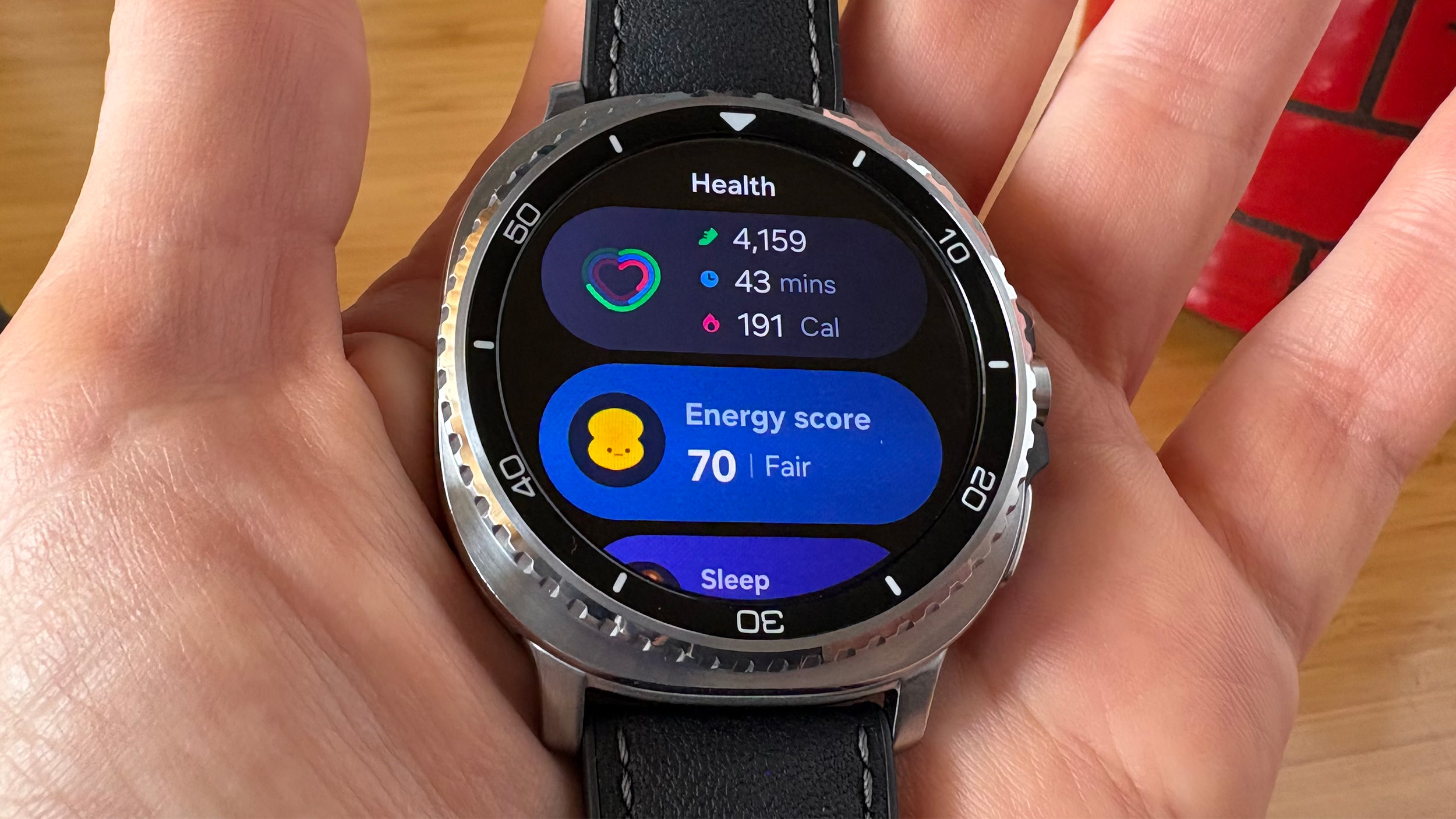 Health tiles on the Galaxy Watch 8 Classic display the Energy score and activity metrics 
