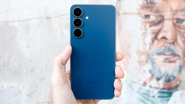 Image of the rear of a Samsung S25 Fan Edition held in the air. Image of the rear of a Samsung S25 Fan Edition held in the air.