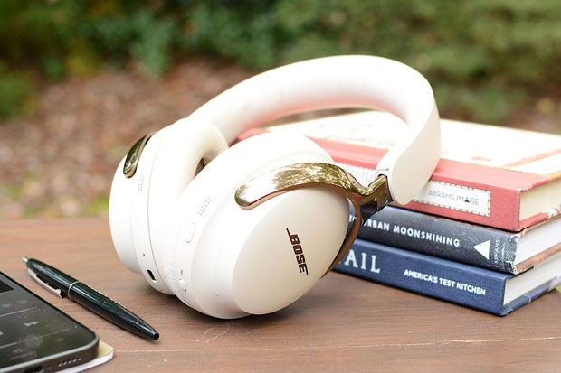 Image of a pair of Bose headphones on a table. Image of a pair of Bose headphones on a table.